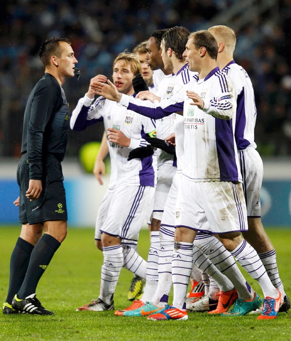 Anderlecht's players argue with referee Ivan Bebek during their Champions League Group C soccer match at Petrovsky stadium against Zenit St. Petersbur 
