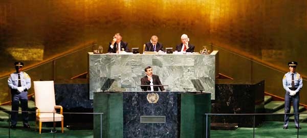 President of Iran Mahmoud Ahmadinejad gestures during his address to the 67th United Nations General Assembly at U.N. headquarters in New York, September 26, 2012.