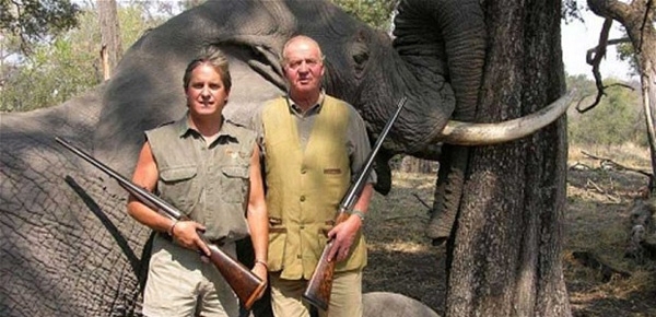 The King appeared on the web page of the safari company, Rann Safaris, beside an elephant he killed earlier during the trip 