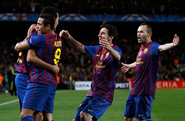 Barcelona's Busquets is congratulated by team mates Sanchez, Messi and Iniesta after scoring a goal agaisnt Chelsea during their Champions League socc 