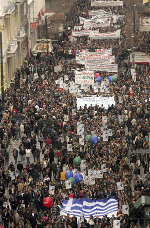 Protesters march during a mass anti-government rally in central Athens