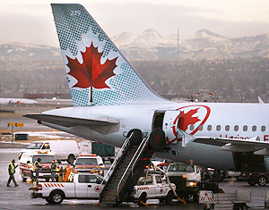 Emergency crews surround an Air Canada plane at Calgary International Airport 