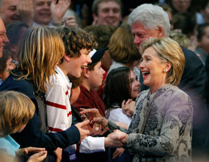 Democratic presidential candidate U.S. Senator Hillary Clinton (D-NY) greets supporters with her husband, former U.S. President Bill Clinton, at her New Hampshire primary night rally in Manchester, January 8, 2008. REUTERS