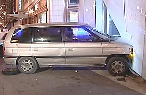 A Mazda MPV minivan is seen after it crashed into WLS-TV's studio in downtown Chicago