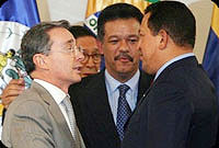 Colombia's Pres. Alvaro Uribe (L) shakes hands with Venezuela's Pres. Hugo Chavez (R)