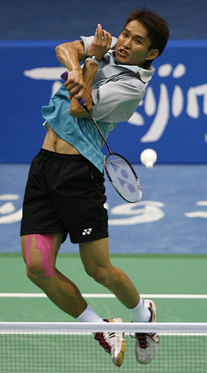Hsieh Yu-hsing of Taiwan hits a return to Kaveh Mehrabi of Iran during their men's singles first round badminton match at the Beijing 2008 Olympic Games