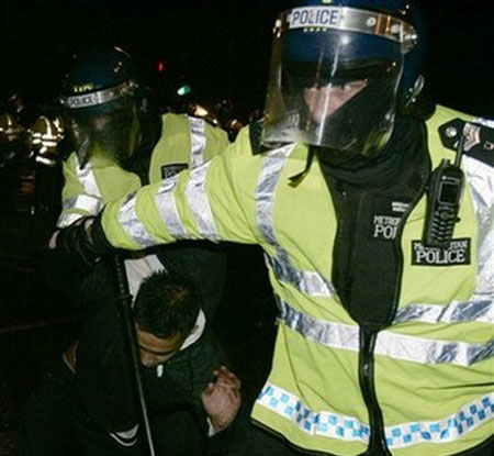 British police officers clash with protesters 