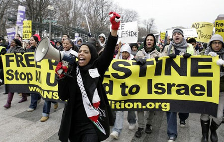 Demonstrators protest during a pro-Palestinian rally outside the White House in Washington, DC on January 10, 2009.