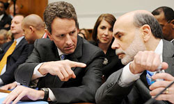 Treasury secretary Timothy Geithner talks to Federal Reserve chairman Ben Bernanke before testifying about the AIG bonus scandal. Photograph: Matthew Cavanaugh/EPA