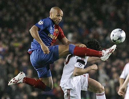 FC Barcelona's Thierry Henry vies for the ball against Bayern Munich's Massimo Oddo during their Champions League quarterfinal 1st leg soccer match at the Camp Nou stadium in Barcelona, Spain, Wednesday, April 8, 2009.