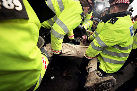 A demonstrator struggles with police during demonstrations in Bishopsgate in London, on April 1, 2009. 