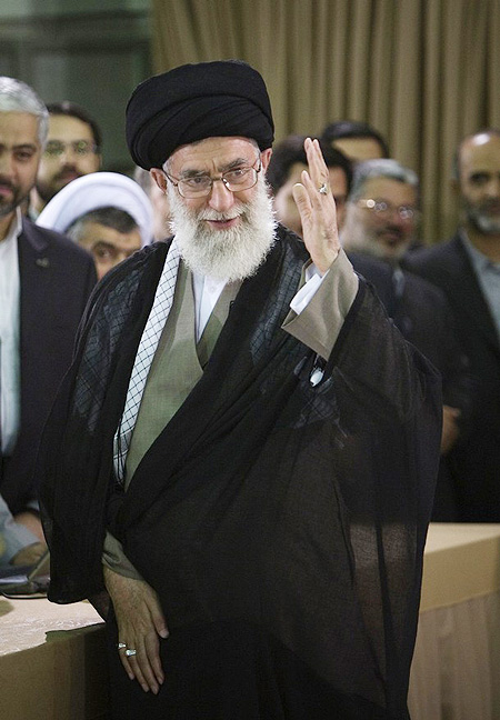 Iran's Supreme Leader Ayatollah Ali Khamenei waves to journalists before voting in the Iranian presidential election in Tehran June 12, 2009.