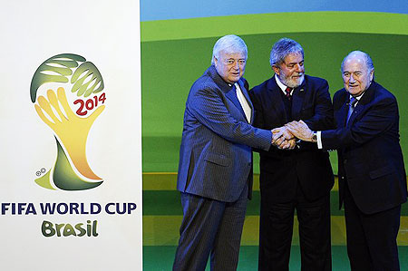 razilian President Luiz Inacio Lula da Silva (C), Brazil 2014 World Cup organizing committee president Ricardo Texeira (L) and FIFA president Joseph Sepp Blatter (R) join hands as they celebrate the official launch of the FIFA World Cup 2014 Brazil Logo on July 8, 2010 at the Sandton Convention Center in Johannesburg.