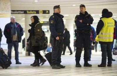 Police officers patrol the Central railway station in Stockholm