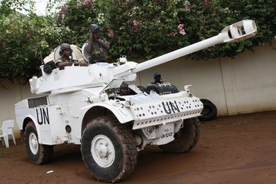 United Nations soldiers from Senegal stand guard outside the home of opposition leader Alassane Ouat