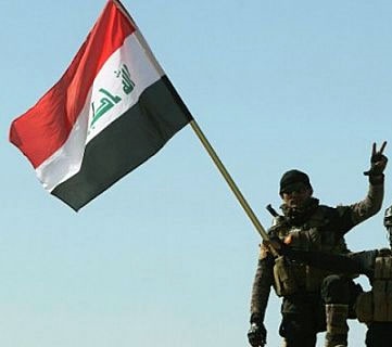  پرچم عراق بر فراز ساختمان های دولتی در مرکز فلوجه به اهتزاز در آمد